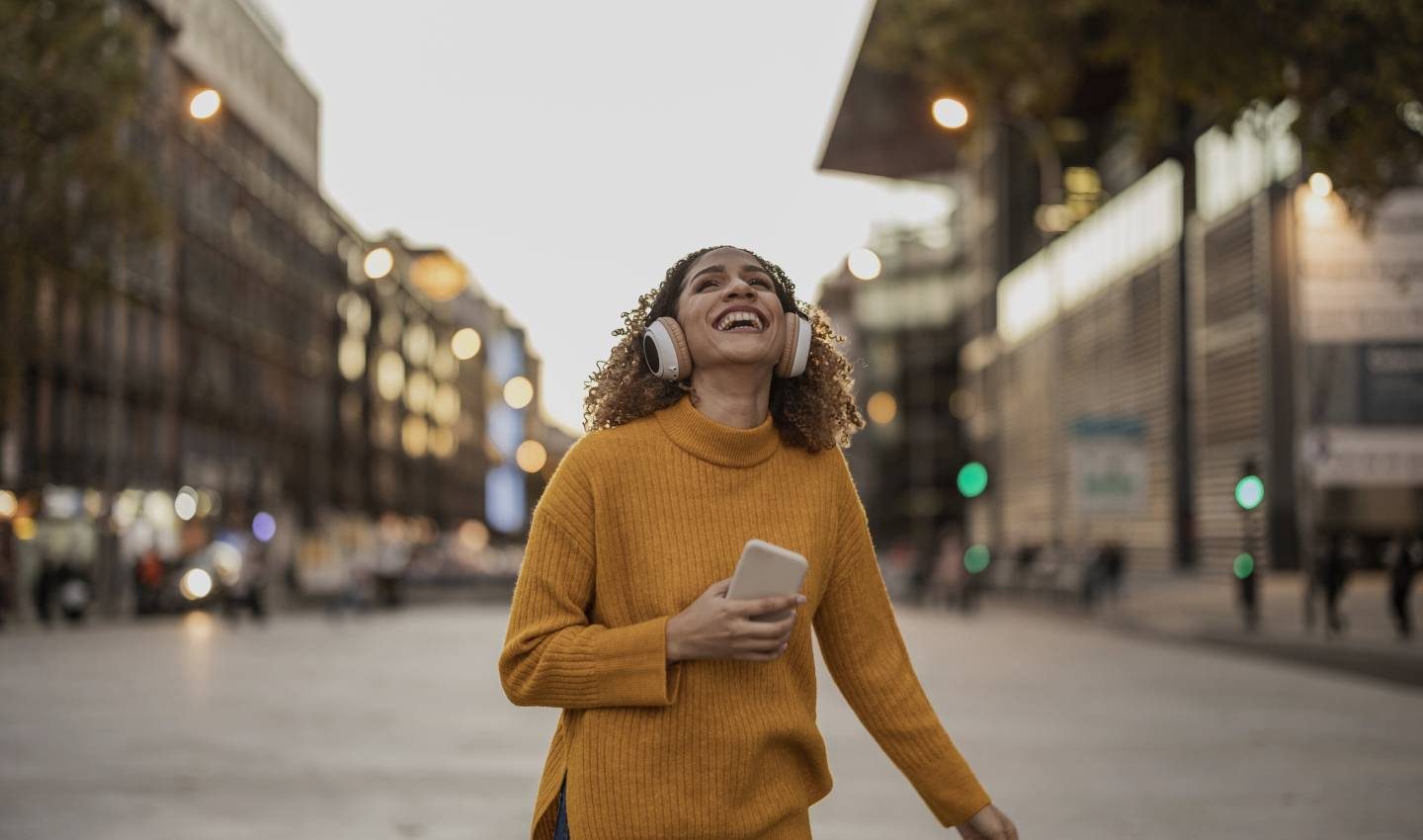 Woman smiling in a city street