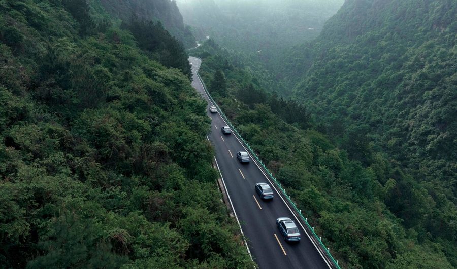 Geely cars driving on a mountain road