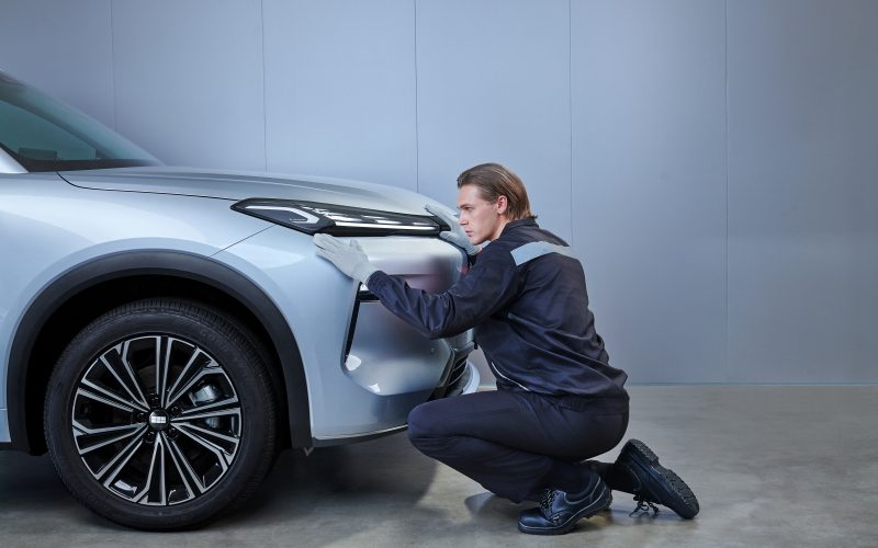 Technician inspecting a Geely